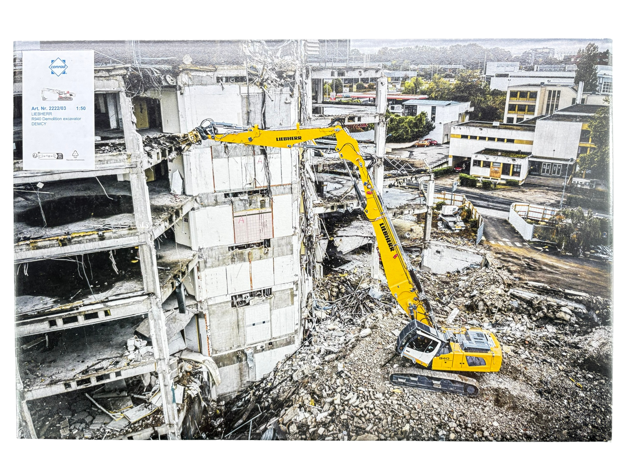 Conrad Liebherr R 940 Demolition Hydraulikbagger in der Werbeausführung DEMCY (Eiffage Génie Civil) – Diecast Sondermodell im Maßstab 1:50, Zinkdruckguss mit wechselbarer Abbruchausrüstung, Art. 2222/03